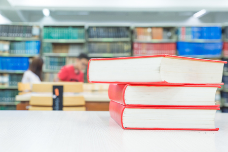 A pile of books with library on the backの写真素材