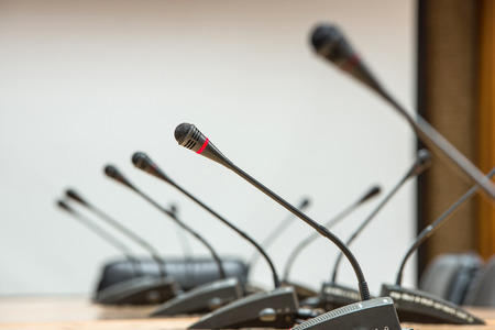 before a conference, the microphones in front of empty chairs.Selective focus.の写真素材