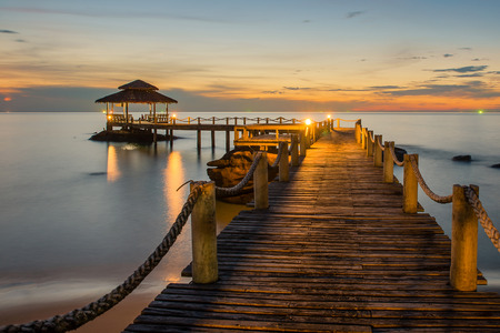 Landscape of Wooded bridge pier between sunsetの写真素材