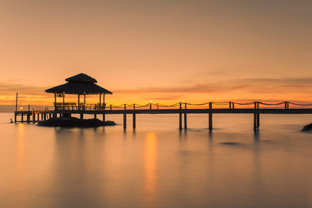 Landscape of Wooded bridge pier between sunset. Summer travel in Phuket ,Thailand.の写真素材