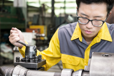 Mechanical Engineering control lathe machine in factoryの写真素材