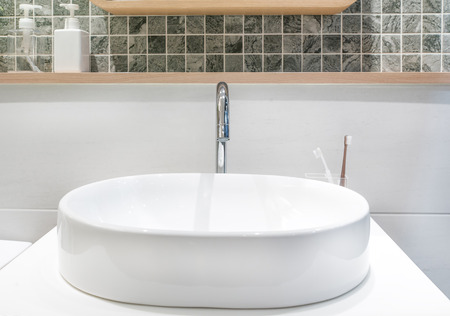 Closeup of a wash basin in a modern bathroomの写真素材