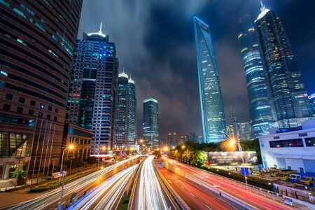 Shanghai traffic at night in Lujiazui business center, Shanghai, Chinaの写真素材