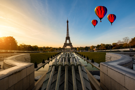 Hot air balloon with sunrise in Eiffel Tower in Paris, France. Eiffel Tower is famous place in Paris, France.の写真素材