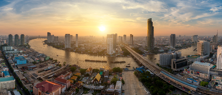 Panorama of Bangkok city skyline and skyscraper along Chao phraya river in sunset time at Bangkok, Thailand.のeditorial素材