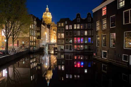 Amsterdam skyline in historical area at night, Amsterdam, Netherlands. の写真素材