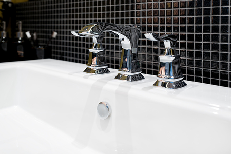Interior of bathroom with sink basin and faucet. Modern design of bathroom.