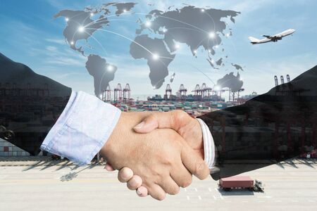 Double Exposure of a businessman handshake  with Map global partner connection of Container Cargo freight ship for Logistic Import Export background (Elements of this image furnished by NASA)の写真素材