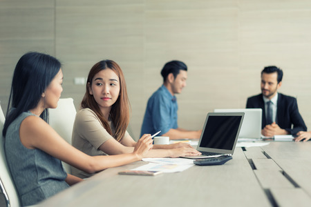 Two Asian Business woman working  and meeting in conference room. Business people discussing together in conference room during meeting at office.のeditorial素材