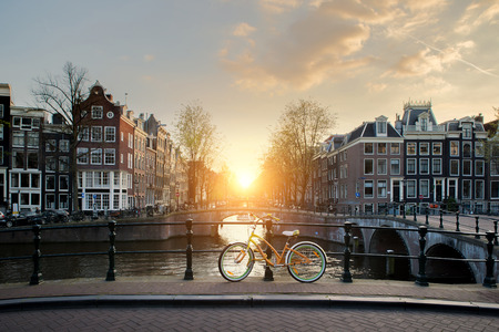 Bicycles lining a bridge over the canals of Amsterdam, Netherlands. Bicycle is major form of transportation in Amsterdam, Netherlands.のeditorial素材