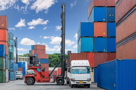 Forklift handling container box loading at docks with truck for Logistic Import Export concept.のeditorial素材