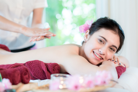 Yougn Asian woman relaxing with hand spa massage at beauty spa salon.の写真素材