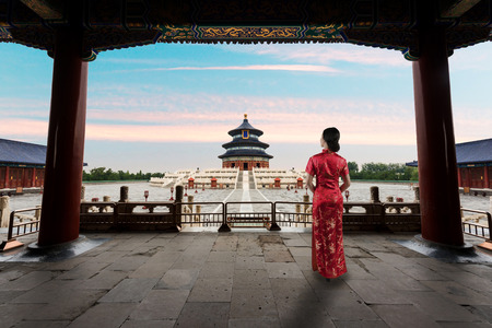 Asian young woman in old traditional Chinese dresses in the Temple of Heaven in Beijing, China.の写真素材
