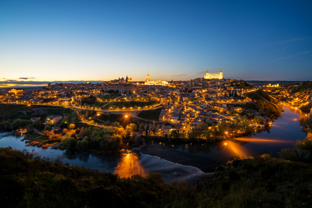 Panoramic view of the medieval center of the city of Toledo, Spain. It features the Tejo river, the Cathedral and Alcazar of Toledo, Spain.の写真素材
