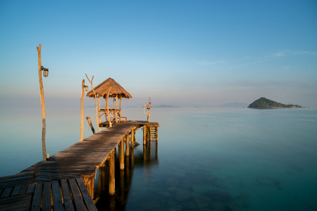 Wooden pier between sunset in Phuket, Thailand. Summer, Travel, Vacation and Holiday concept.の写真素材