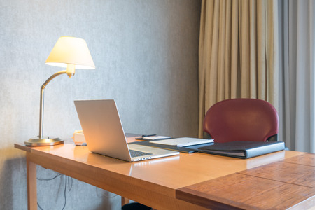 Computer display and office tools on desk in home. Desktop computer screen isolated. Modern creative workspace background. Workspace at home.の写真素材