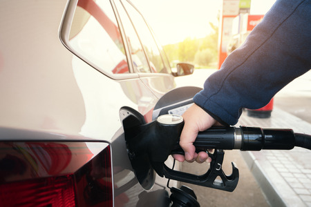 Car refueling on petrol station. Man pumping gasoline oil. This photo can be used for automotive...