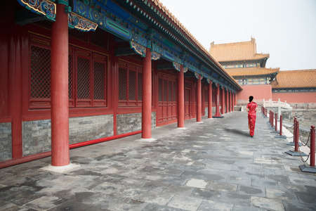 Asian young woman in old traditional Chinese dresses in the Forbidden city in Beijing, China.のeditorial素材