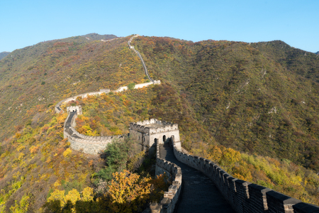 China The great wall distant view compressed towers and wall segments autumn season in mountains near Beijing ancient chinese fortification military landmark in Beijing, China.の写真素材