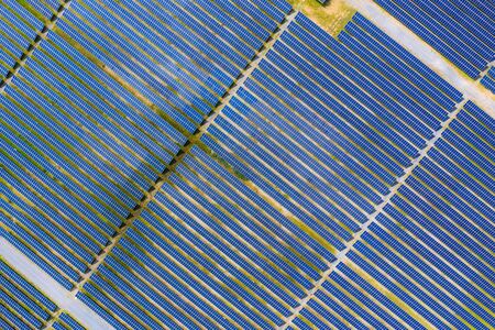 Solar energy farm producing clean renewable energy from the sun. Thousands of solar panels,...