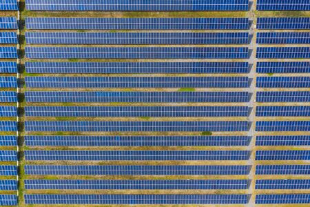 Solar energy farm producing clean renewable energy from the sun . Thousands of solar panels,...