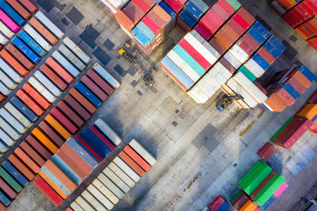 Container ship in export and import business and logistics. Shipping cargo to harbor by crane. Water transport International. Aerial viewのeditorial素材