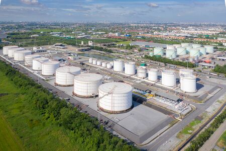 Aerial view of Chemical industry storage tank and tanker truck In wailting in Industrial Plant to tranfer oil to gas station.の写真素材