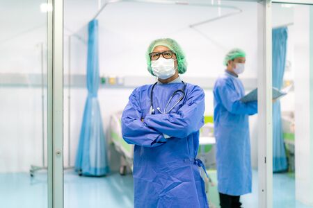 Asian doctor man and doctor team clinic personnel wearing face mask in hospital while Coronavirus outbreak.の写真素材