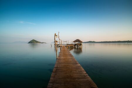 Wooden bar in sea and hut with clear sunrise sky in Koh Mak at Trat, Thailand. Landscape and travel, or nature and sightseeing in summer conceptの写真素材