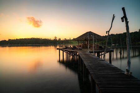 Wooden bar in sea and hut with clear sunrise sky in Koh Mak at Trat, Thailand. Landscape and travel, or nature and sightseeing in summer conceptの写真素材