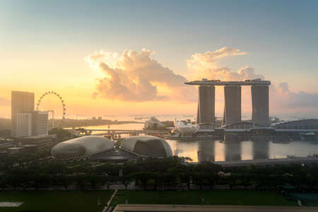 Panorama of Singapore business district skyline and office skyscraper during sunrise in Marina bay, Singapore. Asian tourism, modern city life, or business finance and economy concept.のeditorial素材