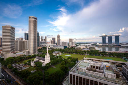 Panorama of Singapore business district skyline and office skyscraper with nice sky cloud in Marina bay, Singapore. Asian tourism, modern city life, or business finance and economy concept.のeditorial素材