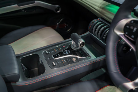 EV gear shift, a blend of form and function. Illuminated buttons beckon touch, promising seamless propulsion and futuristic driving.の写真素材