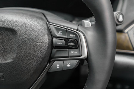Enhance your driving experience with our steering wheel featuring multi-function buttons for easy...