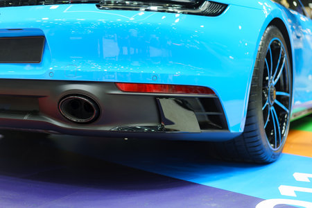 Intricate design of a sport car's exhaust pipe. This close-up view celebrates the precision and...