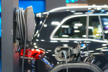 Fast EV chargers in a park setting charging stations stand ready to power electric vehicles swiftly, symbolizing the seamless integration of cutting-edge technology and eco-conscious transportationの写真素材