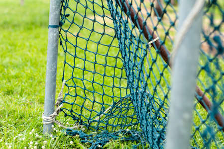 Mesh soccer football goal through the net.の写真素材