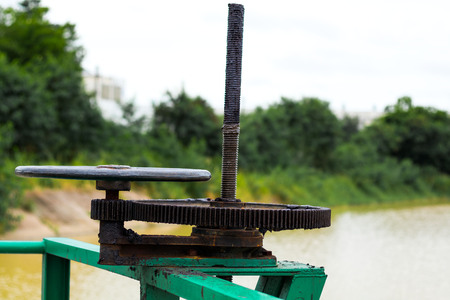 Iron Floodgate Valve on a Canalの写真素材