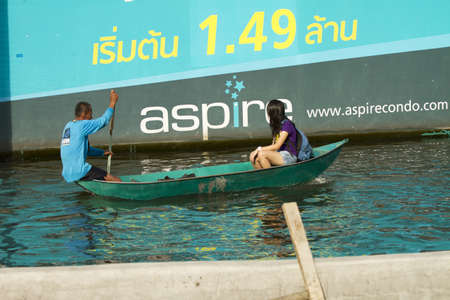 BANGKOK, THAILAND - NOV 12: Commuter transporting by taxi boat after the city was flooded on November 12, 2011 in Bangkok, Thailand.のeditorial素材