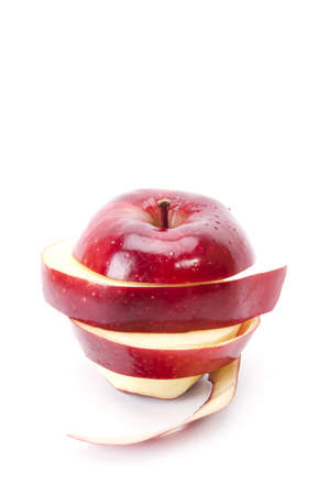 peal apple, red apple pealed and sliced put back to round shape.の写真素材