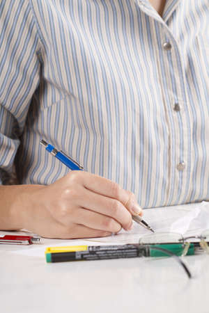 making note, secretary write a note for boss.
