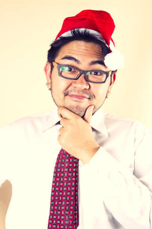 Santa decision, Businessman wear red Santa hat making decision.の写真素材