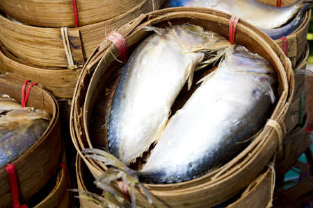 sardine basket, two sardines in bamboo basket.