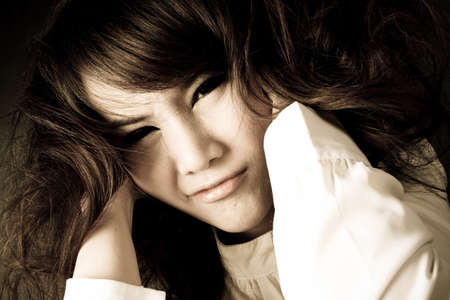 crazy woman, female model grab own hair with face expression.の写真素材