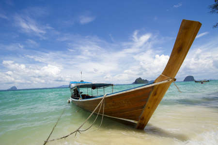 long tail boat, one long tailed boat park on the white beachの写真素材