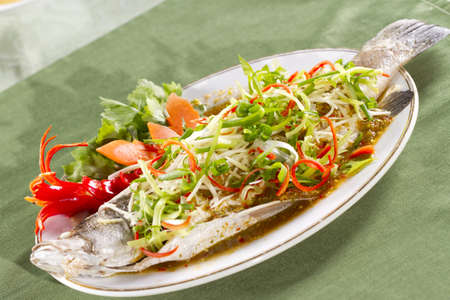 steamed snapper, soy sauce seasoning whole steamed snapper の写真素材