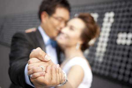 the wedding, bride and groom together close up ringの写真素材