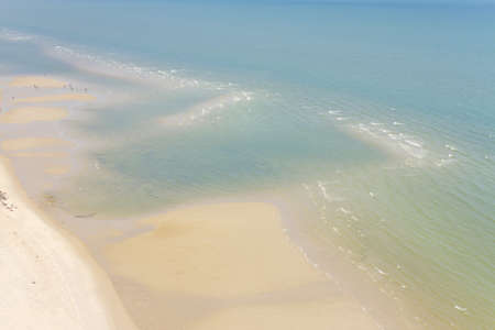 ocean top view, white sandy beach blue sea view from the topの写真素材