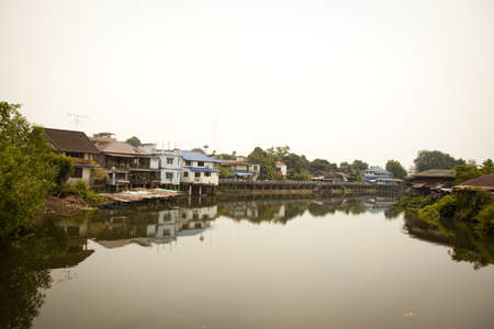 canal city,houses along canal reflection to water in thailand の写真素材