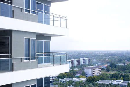 building balcony, building balcony construction made of mirror glass and ironの写真素材